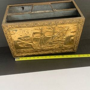 Vintage ship embossed magazine holded